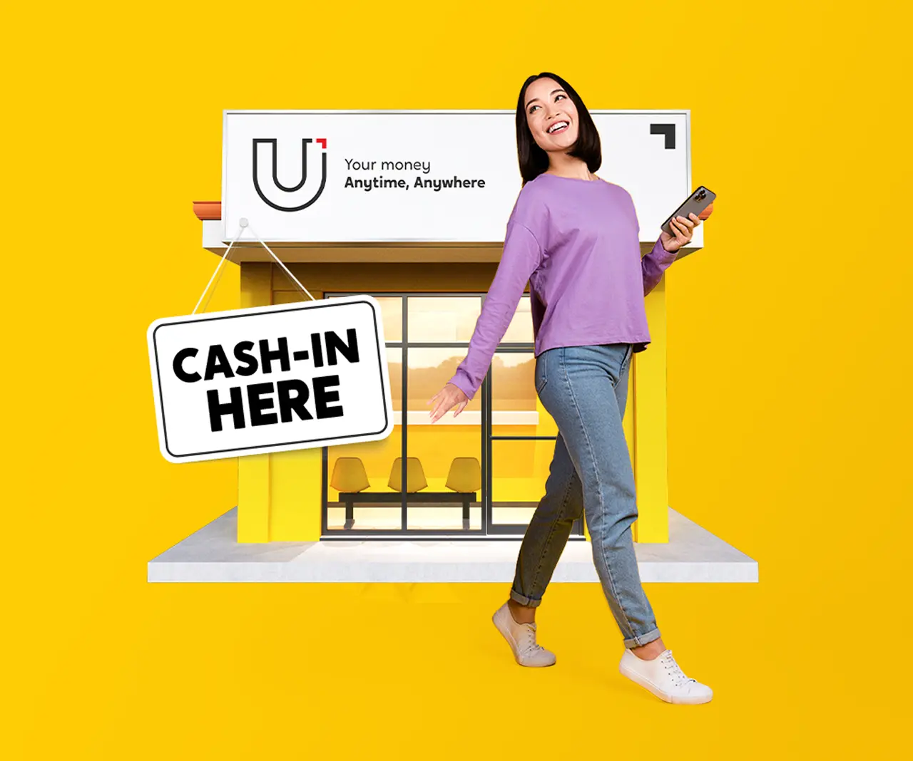 A woman holding a phone standing in front of a U Store with the sign Cash-in Here