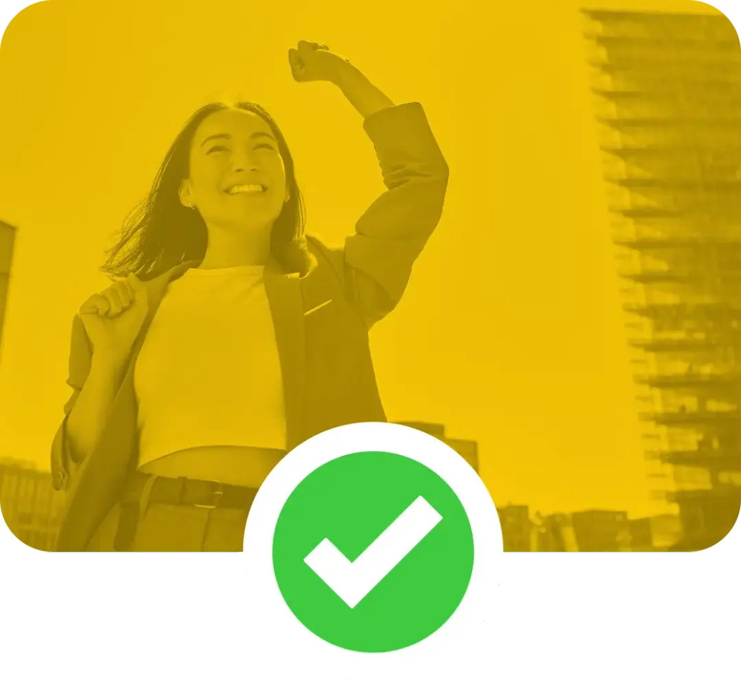 Image of a smiling professional woman, with her left arm raised in triump.