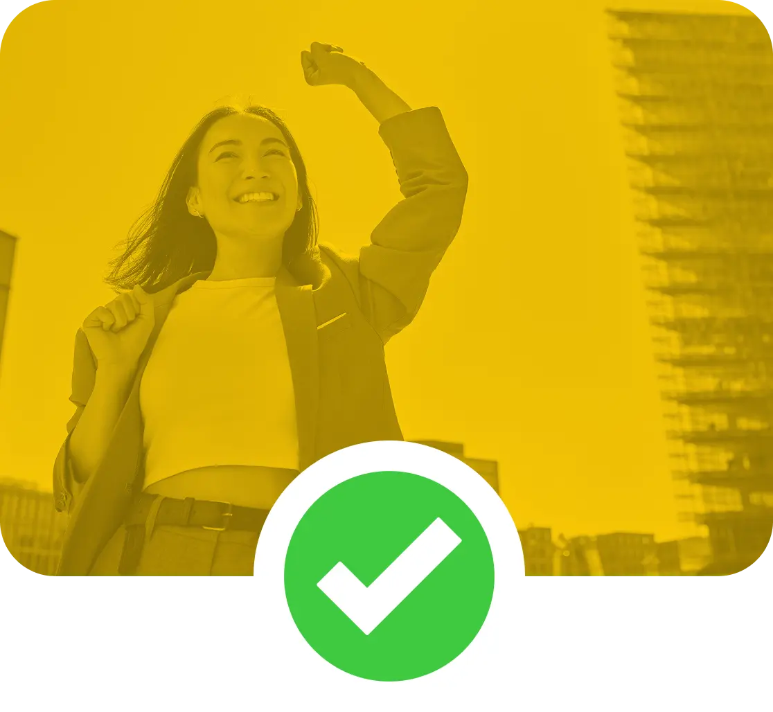 Image of a smiling professional woman, with her left arm raised in triump.